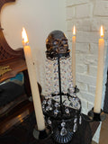 Skull four arm candle holder